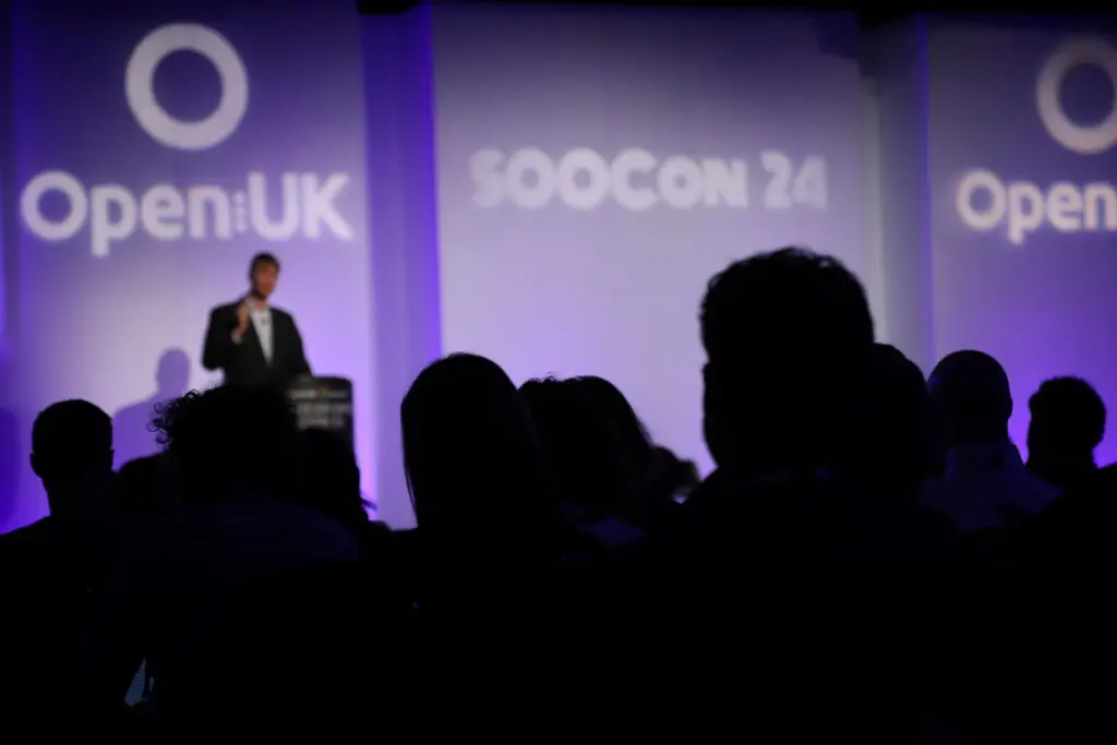 Image of the stage and audience of Open UK conference. Image provided by Open UK.