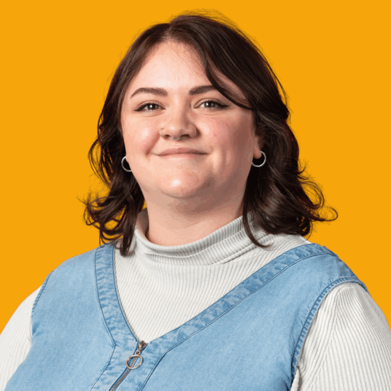 Amber Isaacs Headshot Orange Background