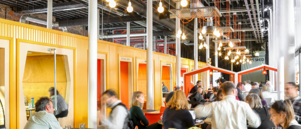 A crowd of people inside Engine Shed's members lounge