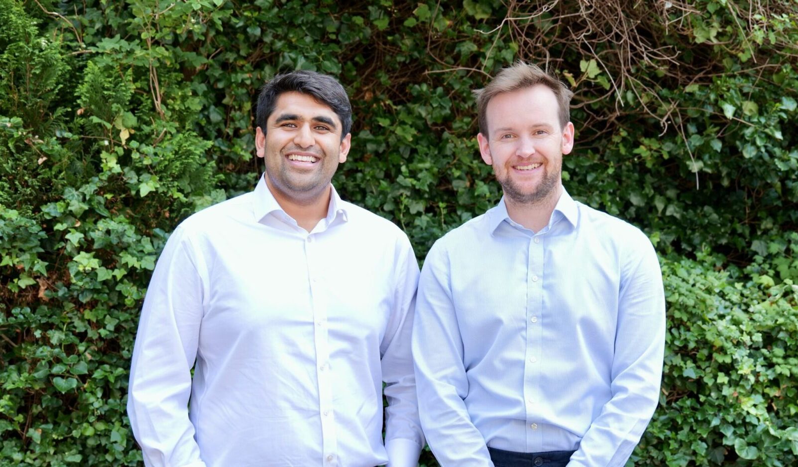 two project voxel cofounders in front of foliage.